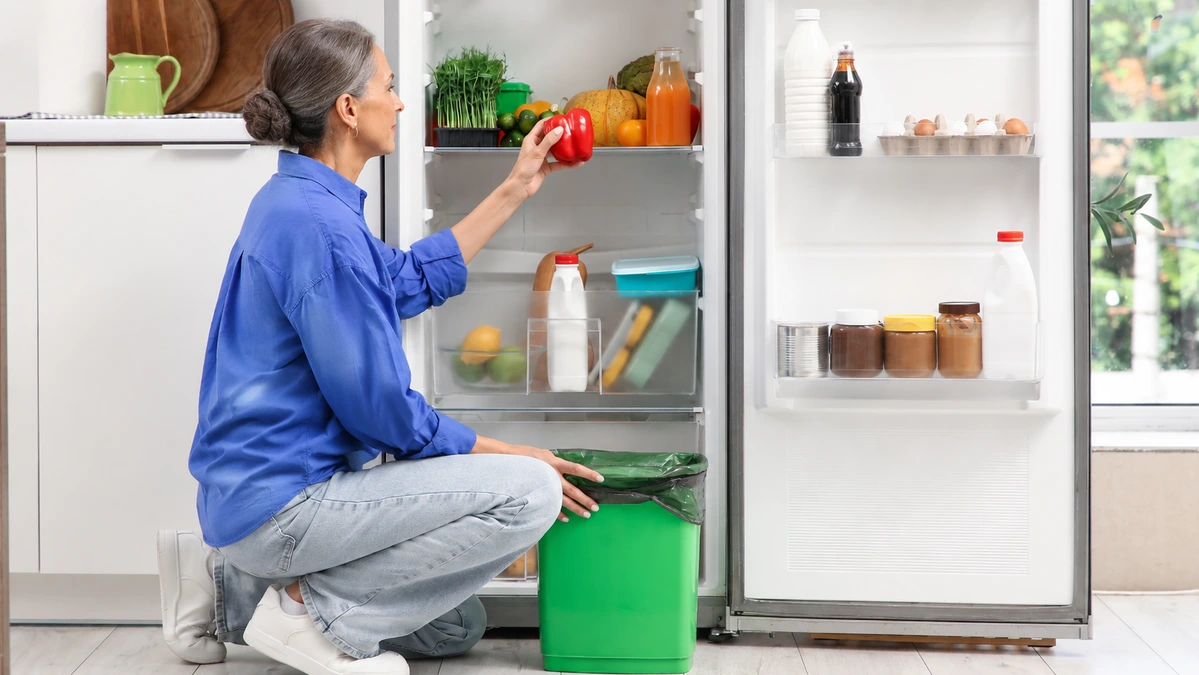 Foods you shouldn't refrigerate displayed near an open refrigerator, highlighting common storage mistakes that ruin freshness.