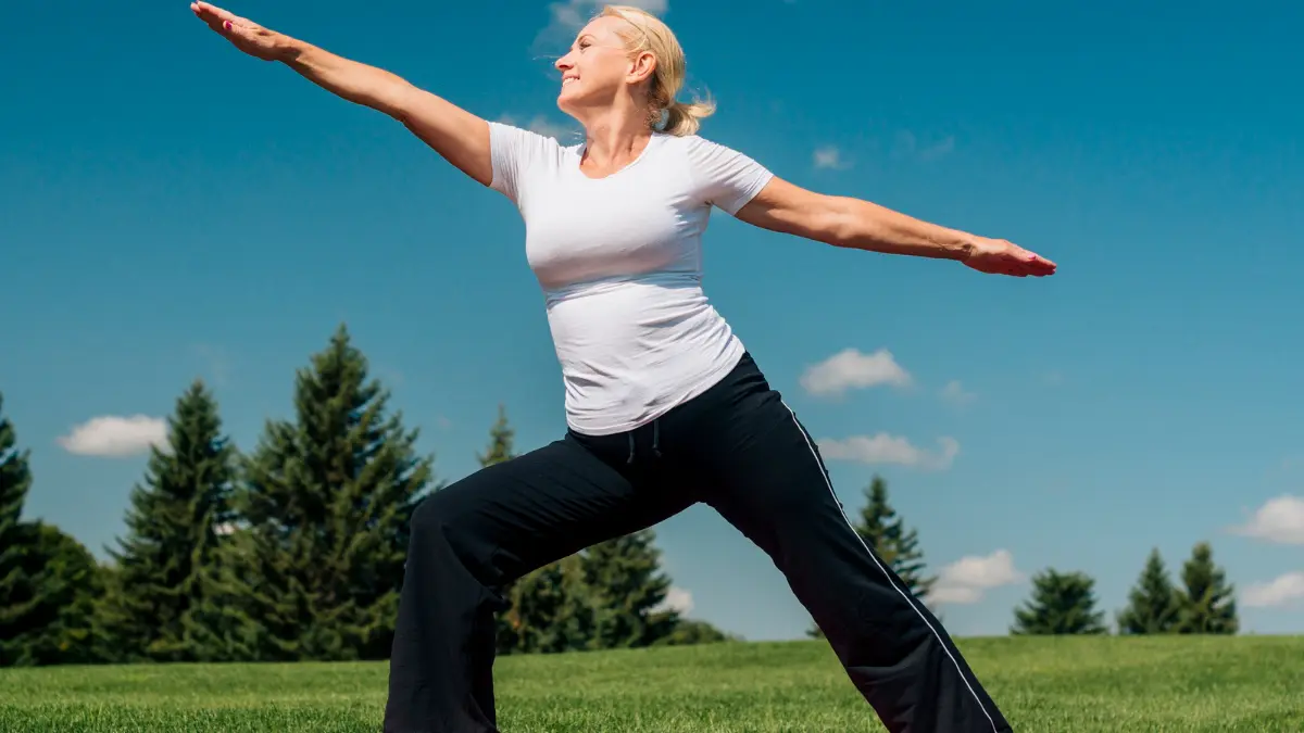 Iron recovery in woman over 50 showing improved energy and mood during morning stretch.