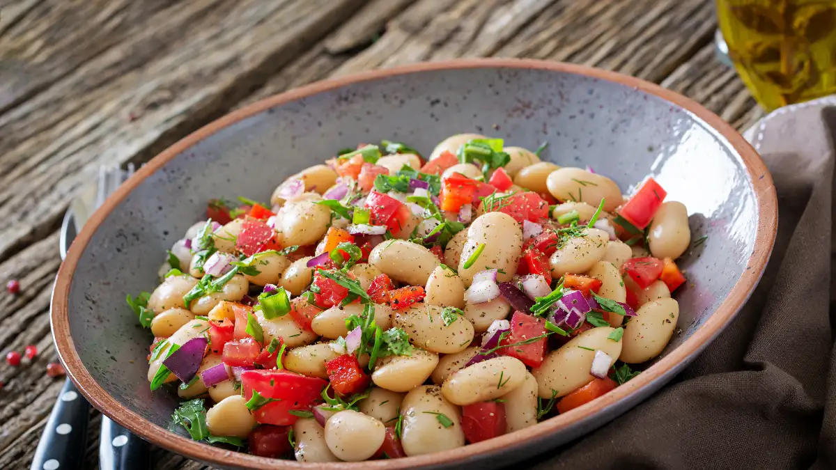 Vibrant Mediterranean salad with chickpeas and kidney beans served in a ceramic bowl