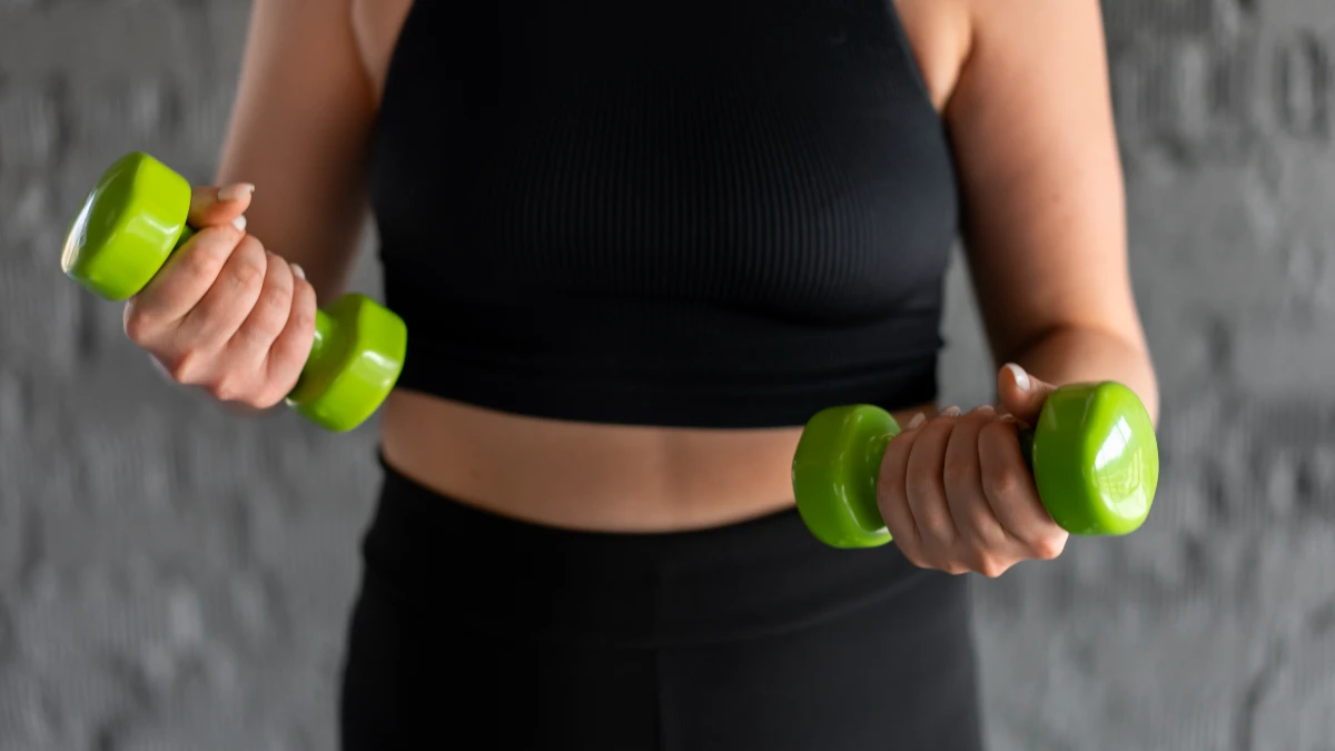 Padded dumbbell grip for arthritis relief during strength training to protect joints and improve longevity