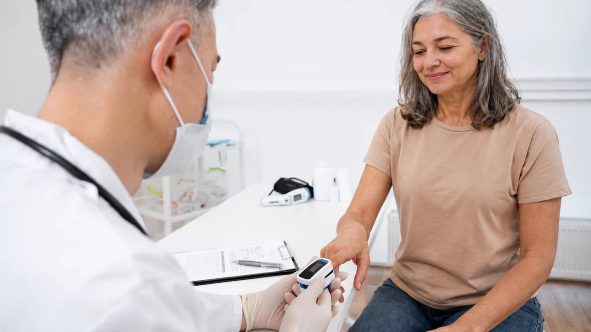 A doctor performing a medical test on a female patient in a clinic representing the hormone blood tests women over 40 should request.