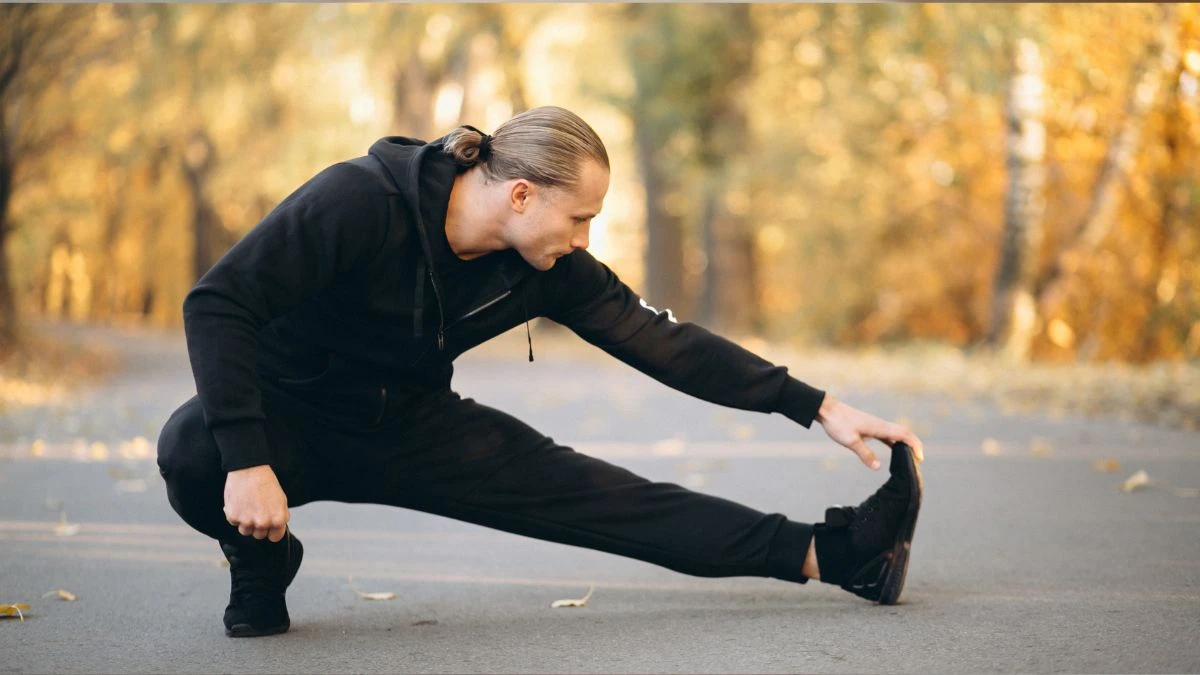 Young man exercise in a sunny park at, physical activity to help wake up your bone-building cells.