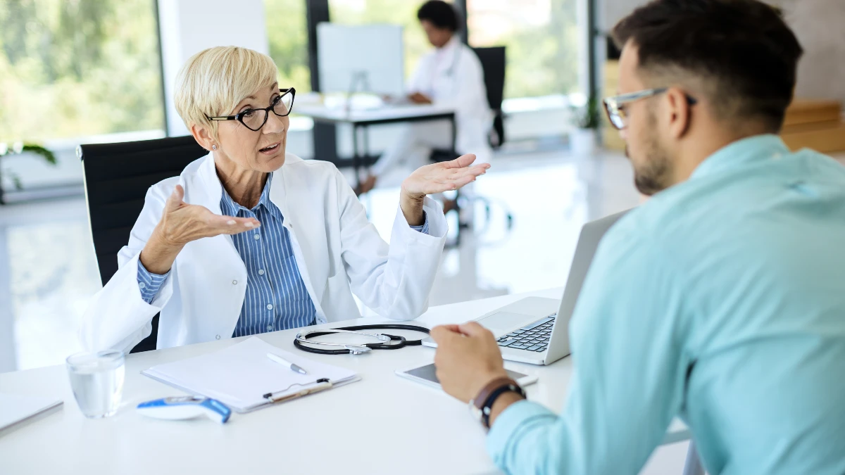 Doctor discussion patient during medical consultation about heart health and Frank's Sign concerns.