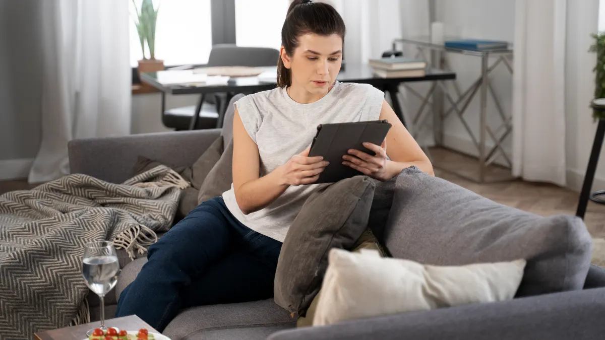 Mature woman checks a moon phase calendar to support natural hormone regulation when her cycle is irregular.