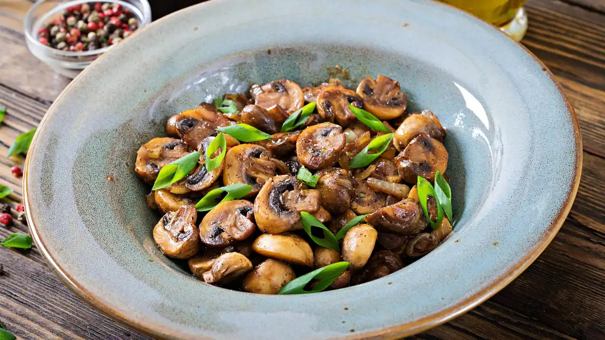 Vitamin D for muscle recovery supported by sautéed wild mushrooms served on a white plate for a late dinner