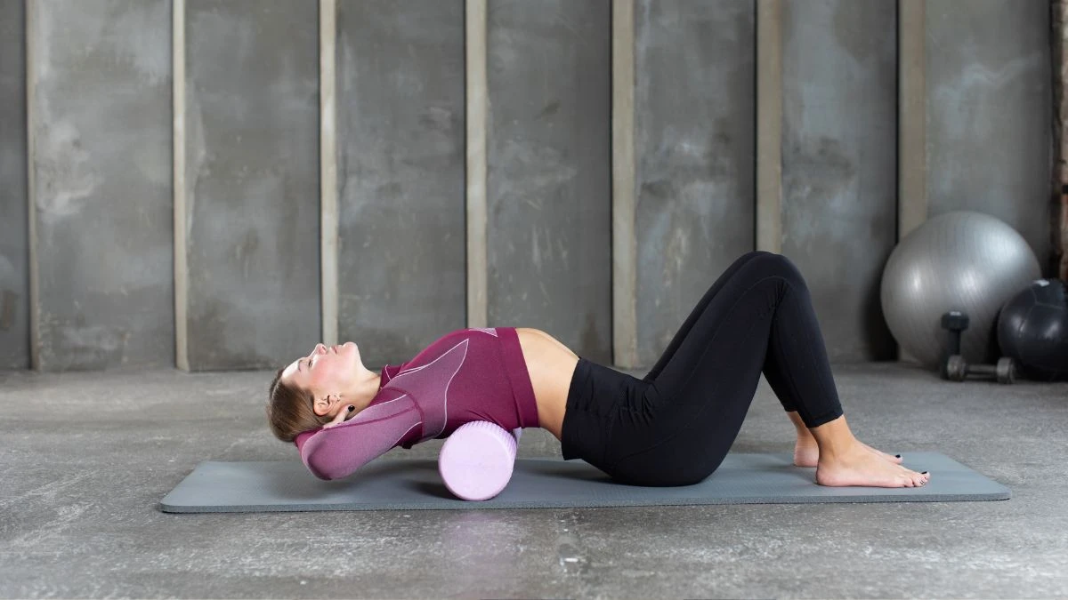 Young woman lying on a hardwood floor at noon breathing deeply, related to being stuck in a permanent inhale