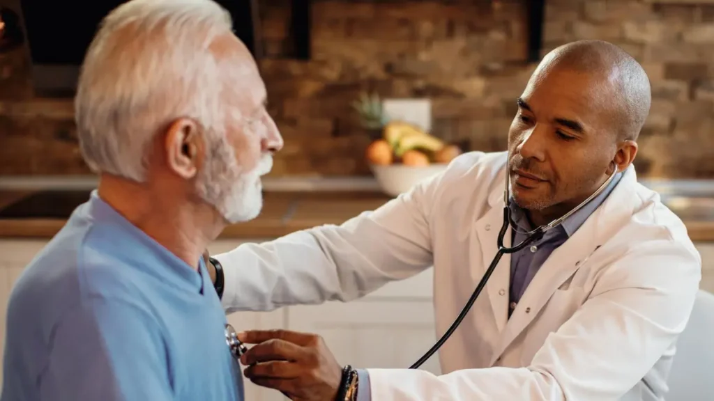 Mature man undergoing a heart-rate evaluation to identify potential cardiac-related morning dizziness red flags.