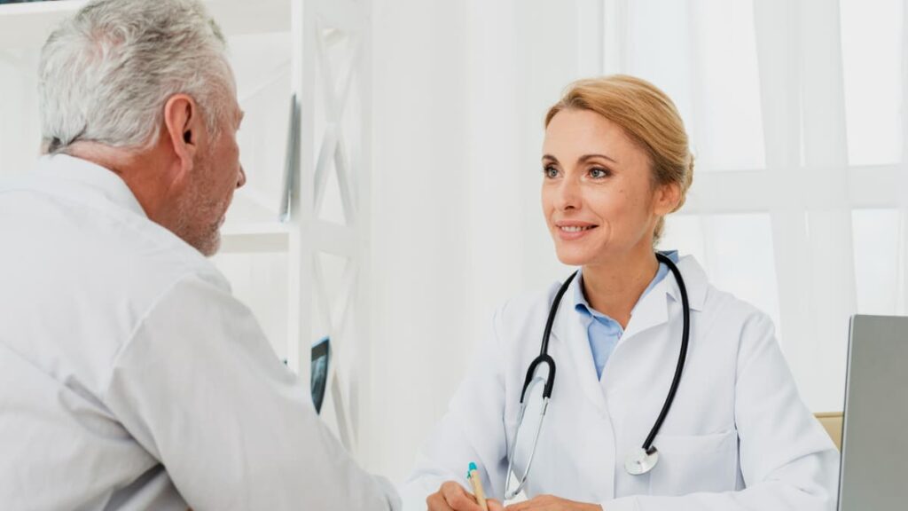 Mature patient consulting with a healthcare provider to analyze 3 AM cortisol patterns and metabolic health.