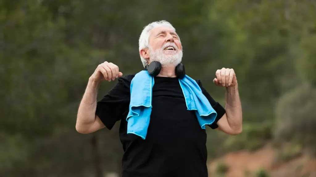 Active older man outdoors enjoying renewed energy and wellbeing after making healthier dietary choices and reducing cravings.