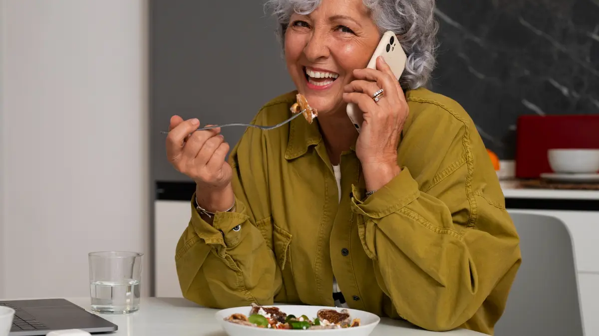 Mature woman enjoying a fig salad to support metabolic flexibility and sustained energy levels throughout the afternoon.