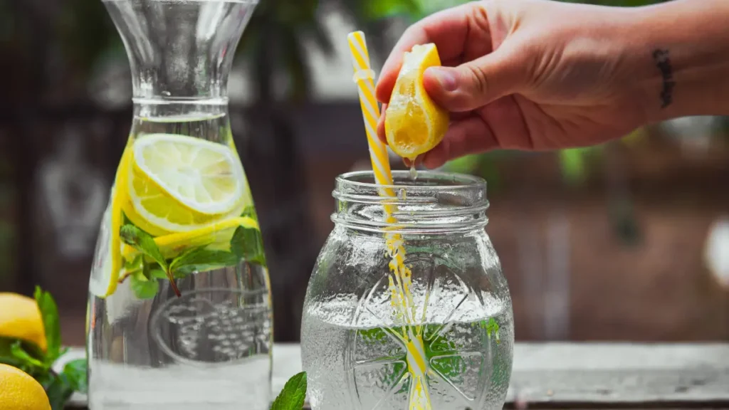 Squeezing fresh lime into salt water to stimulate basal metabolic rate.