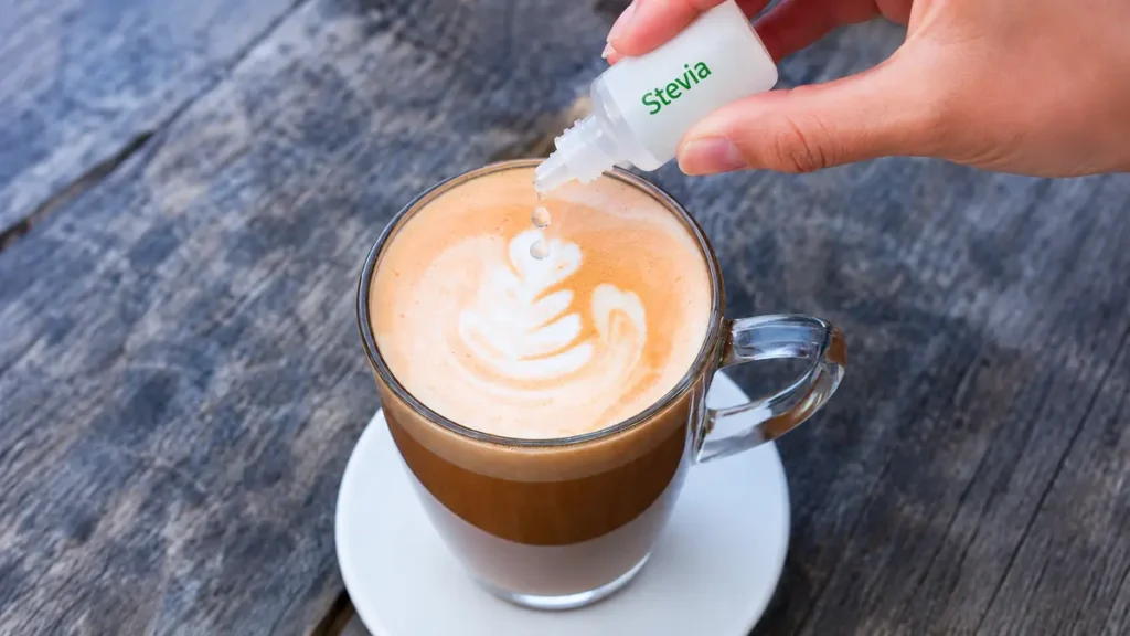 Liquid sweetener drops added to a morning coffee as part of a healthier sugar replacement strategy for adults over fifty.