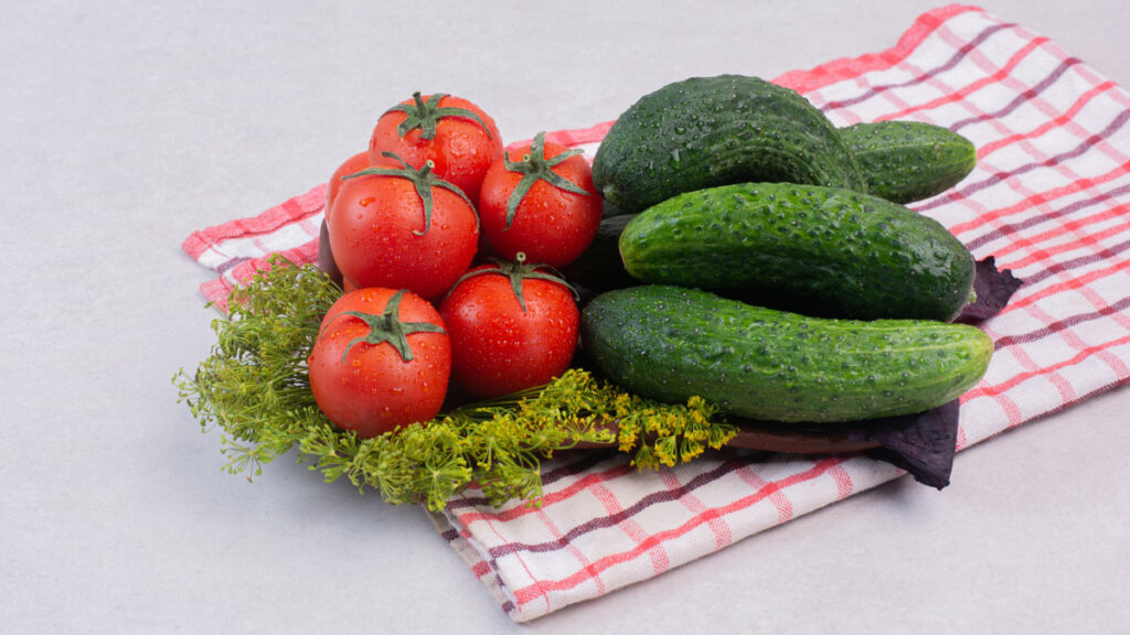 Fresh tomatoes and cucumbers to pair with sprouted bread to support metabolic heat production and healthy digestion.