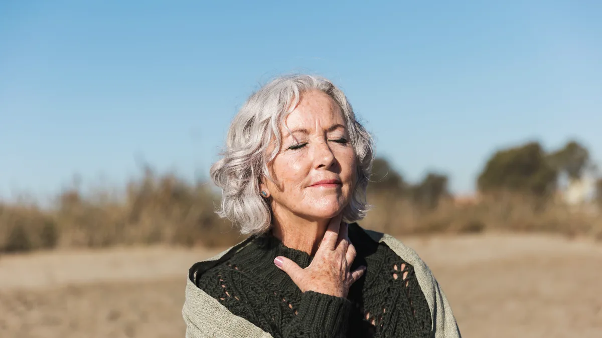 Refreshed mature woman enjoying mental clarity and ATP cellular energy after reducing sugar intake
