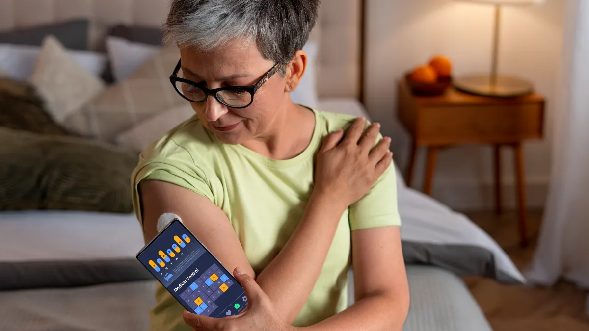 Proactive woman checking her metabolic health data on a smartphone to track liver enzyme trends and MASLD recovery