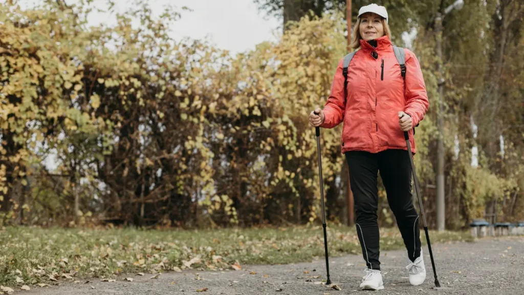 senior woman walking exercise outdoors over 50.