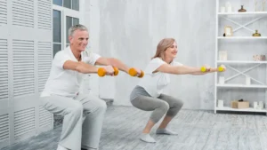 Active mature couple performing joint-friendly strength training with light weights to prevent sarcopenia after 50.