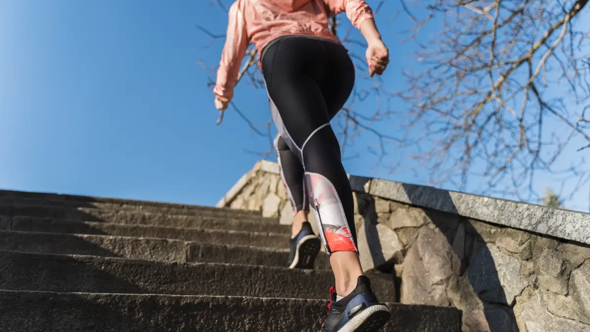 Individual performing high-effort stair climbing bursts to trigger eNOS and stimulate nitric oxide production.