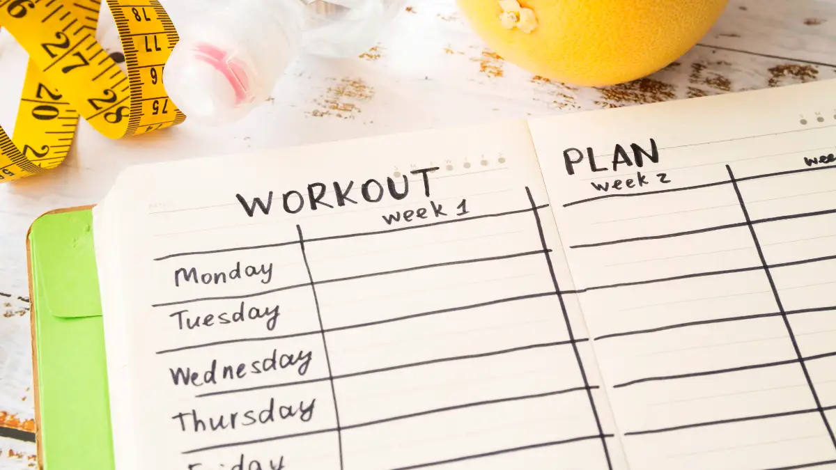 Handwritten weekly workout planner open to Week 1 daily schedule, representing a simple step-by-step fitness plan for adults over 50.