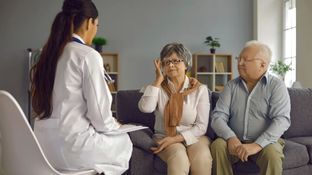 Mature woman speaks with a physician during a warm consultation to safely evaluate her daily medication options.