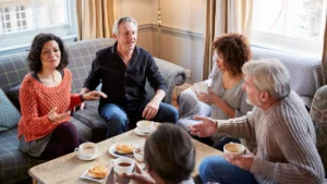 Group of older adults gathered for coffee and an animated conversation to protect their brains after 50.